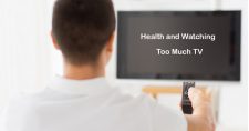 Health and Watching Too Much TV. Picture of a young caucasian male sitting in front of a TV with the remote in his hand.