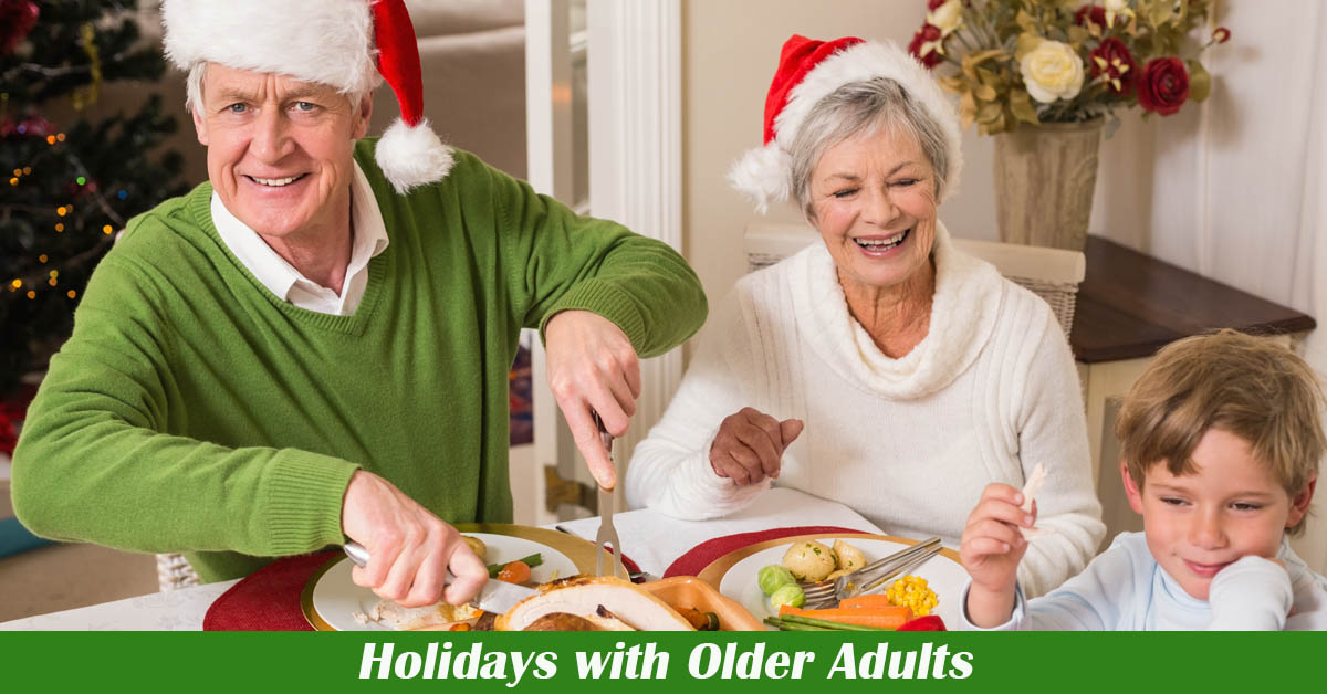 Holidays and Older Adults. Picture of an older caucasian couple sitting at the table for a holiday meal with a very young caucasian male.