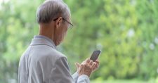 Image of grandpa looking at phone
